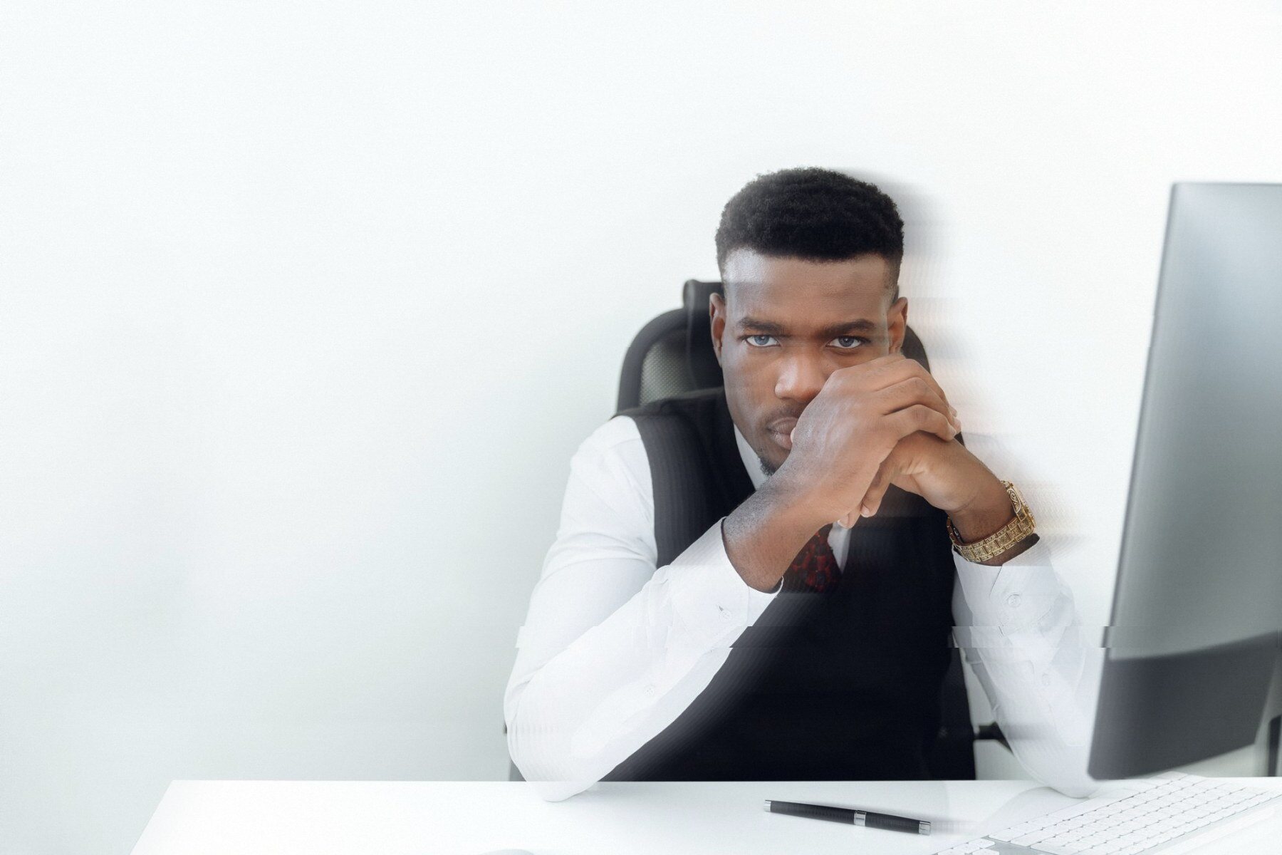 A finance director on a video call. The image is doubled, as if the signal has been copied.